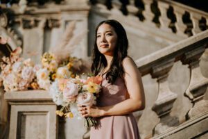 bridesmaid holding a bouquet of flowers